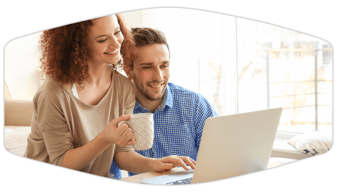 Couple sitting in front of laptop