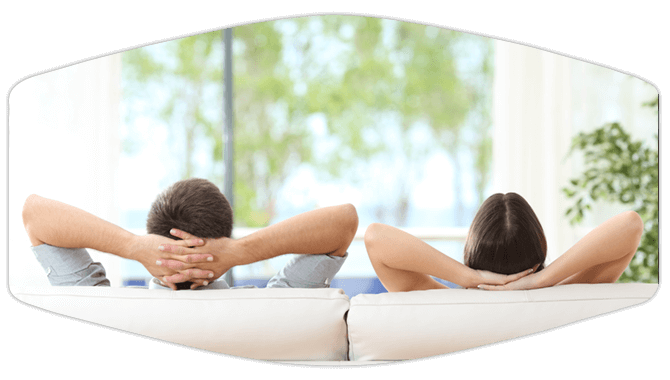 Couple lying on couch relaxing