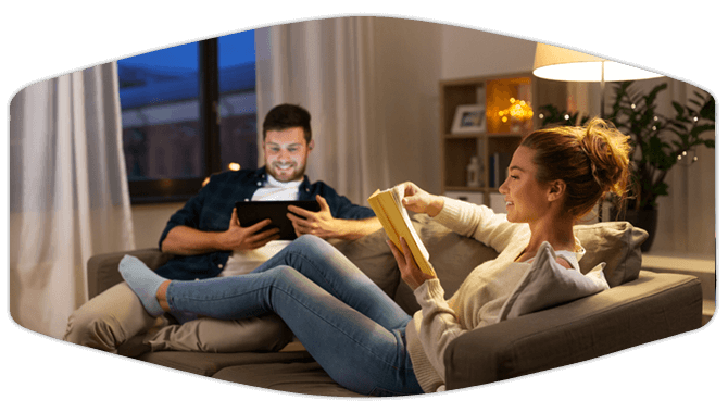 Couple relaxing on living room couch